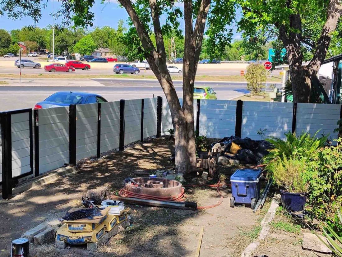 Backyard with tree and construction materials