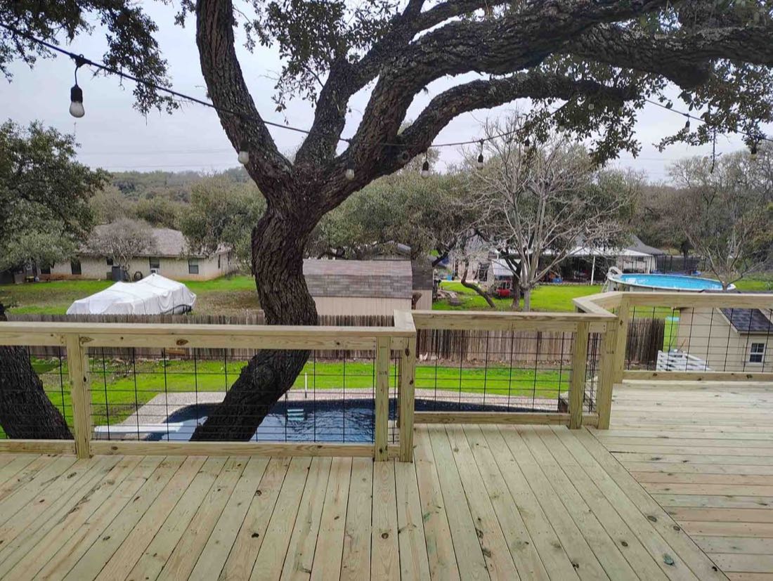 Deck view with tree and pool