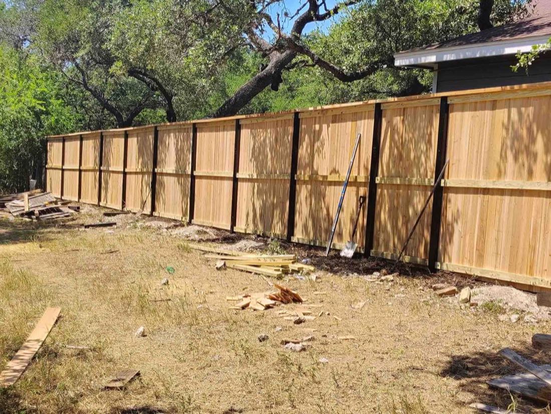 New wooden fence in yard