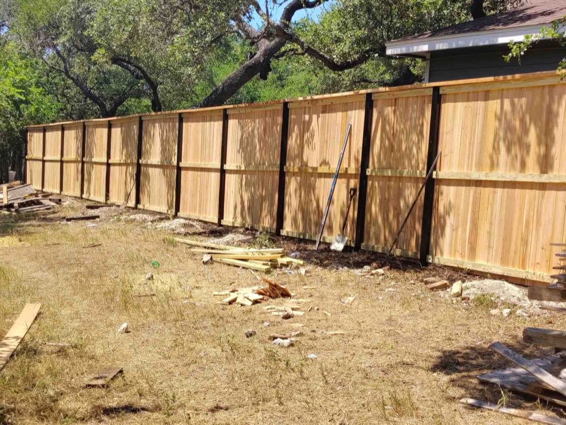New wooden fence in yard