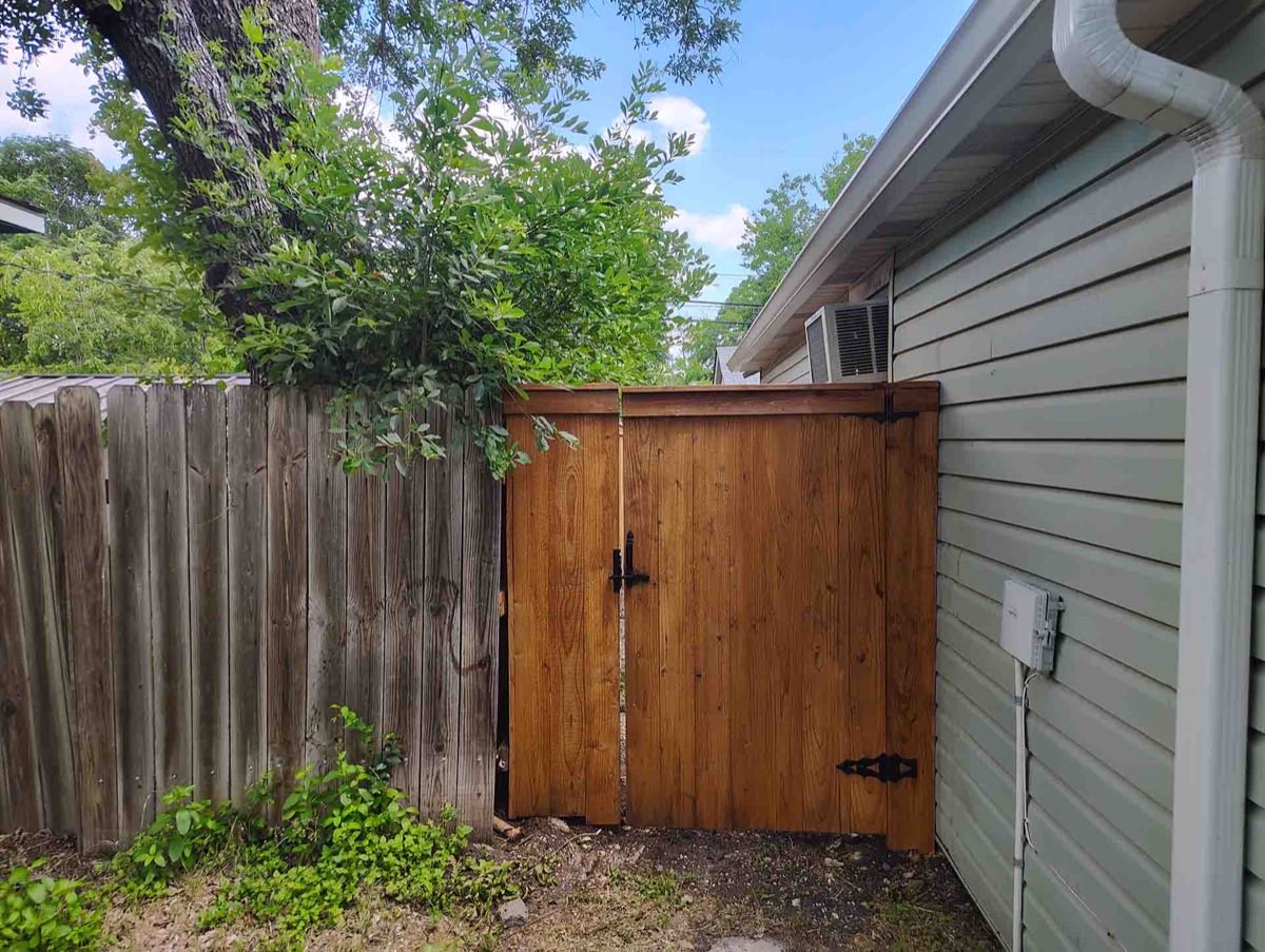 Wooden gate beside a house