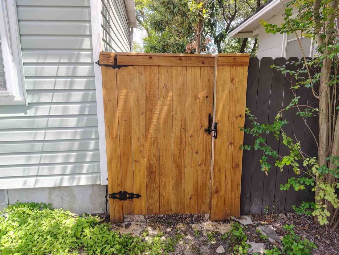 Wooden gate next to a house