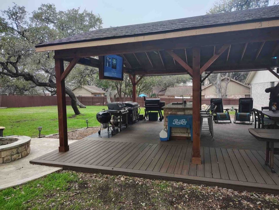 Outdoor patio with grill and TV