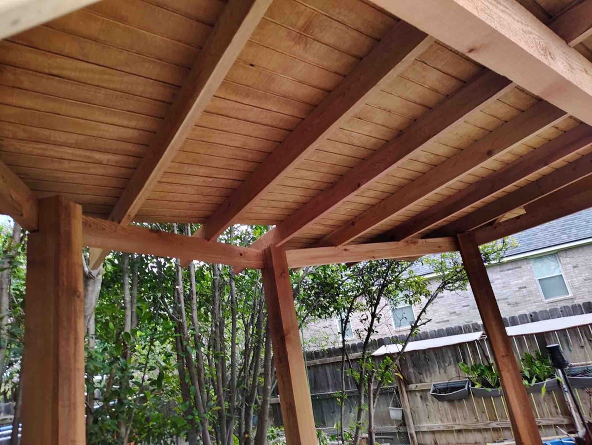 Wooden patio roof with beams