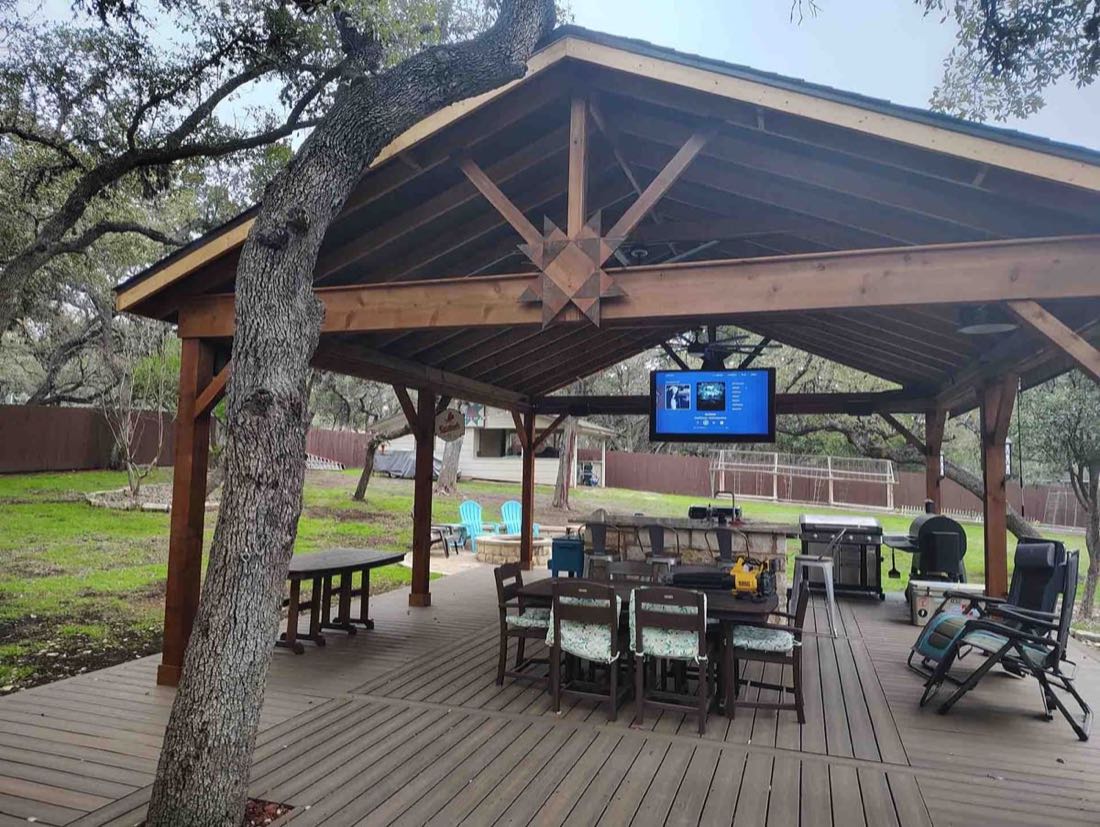 Outdoor patio with seating and TV