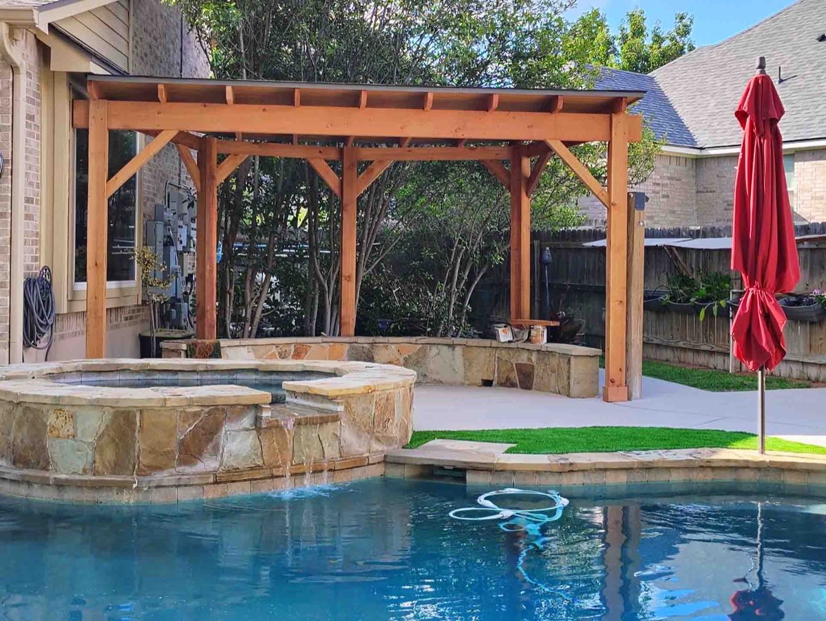 Backyard pool with pergola and umbrella