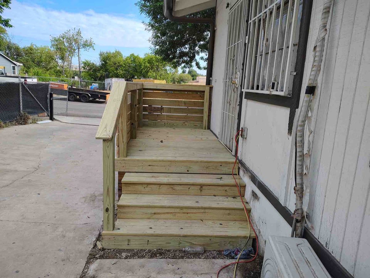 Wooden ramp with stairs and railing