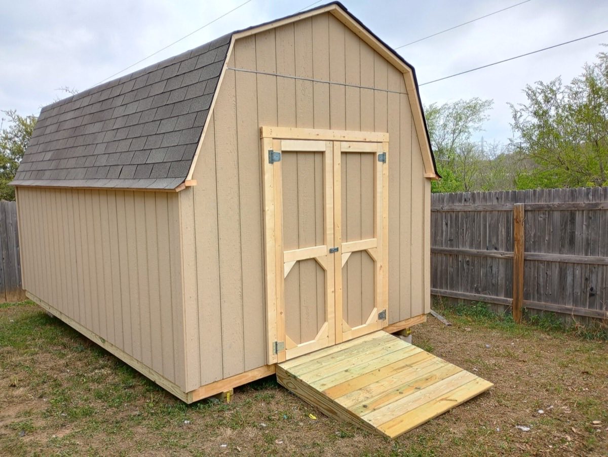 Wooden shed with ramp and doors