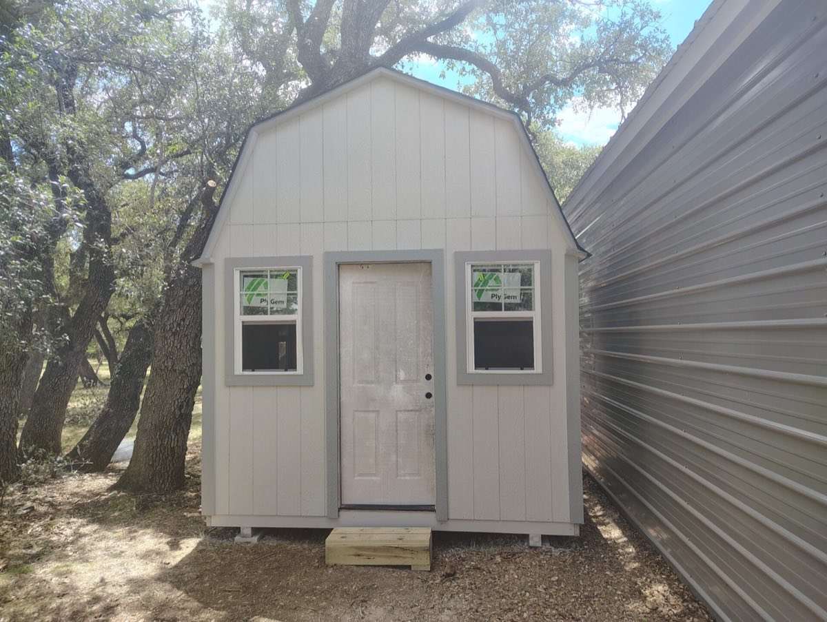 Small shed among trees and metal