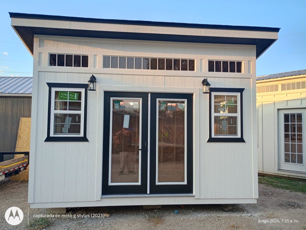 Small white building with black trim