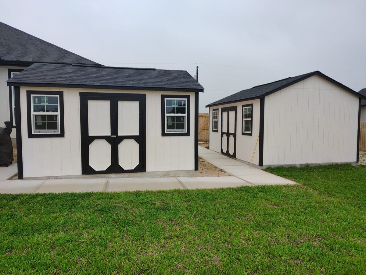 Two storage sheds in grassy area